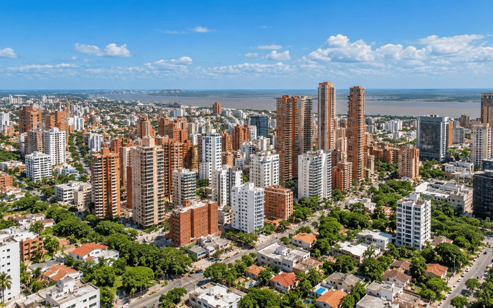 Aerial view of Barranquilla rooftops and high-rises along the Magdalena River, Colombia