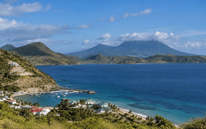 Coastline and Caribbean Sea in St Kitts and Nevis with Nevis Peak across the water