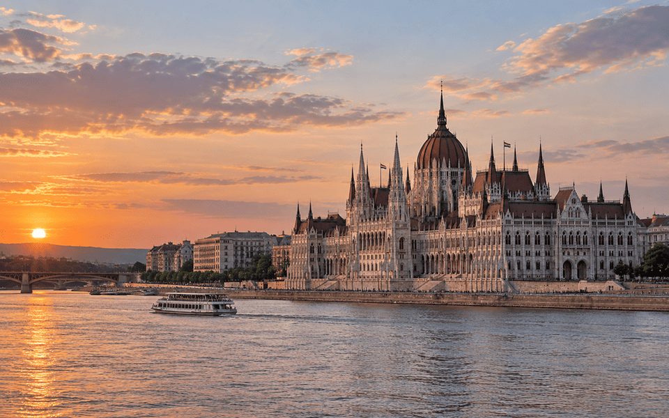 Hungarian Parliament Building along the Danube in Budapest at sunset