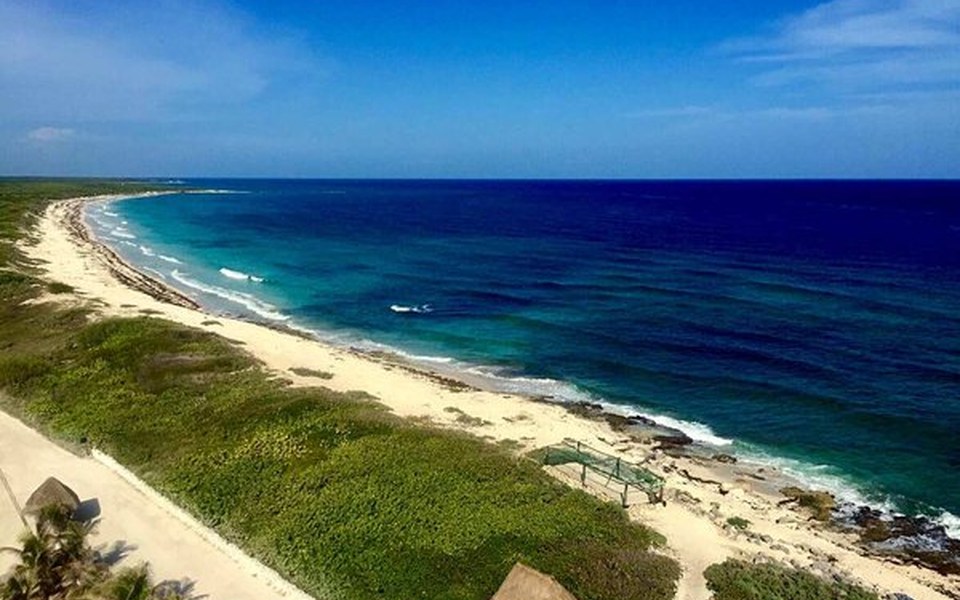 Aerial view of Cozumel's pale sand shoreline and turquoise Caribbean water