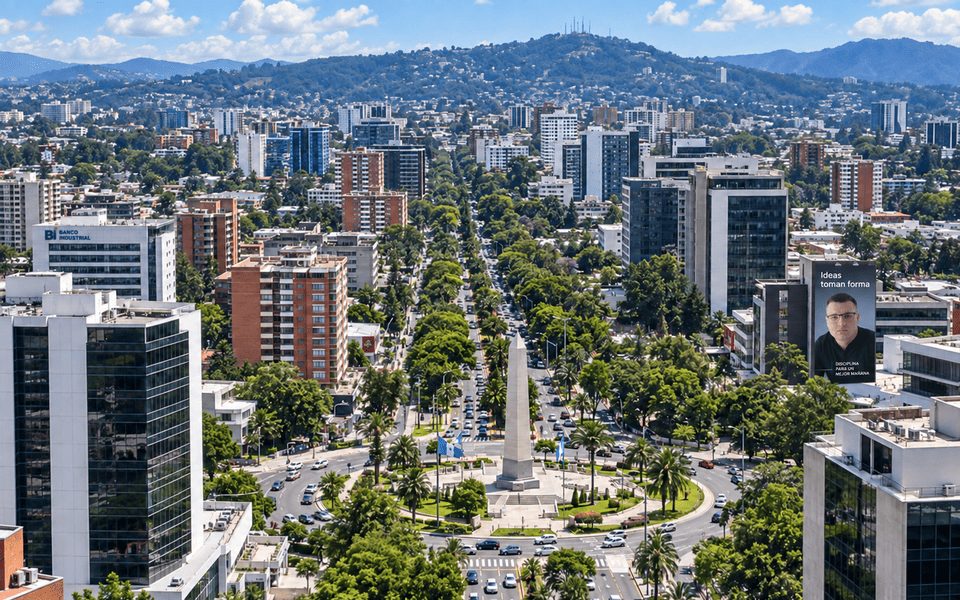 Aerial view of Guatemala City with the Obelisco roundabout and tree-lined Avenida Reforma