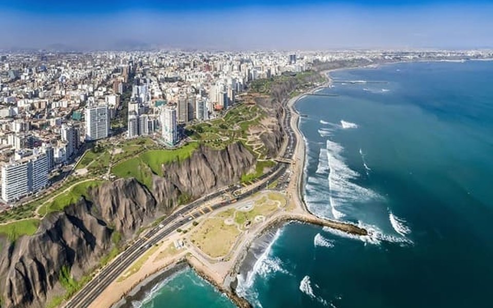 Aerial view of Miraflores in Lima with high-rises along the Costa Verde cliffs above the Pacific Ocean