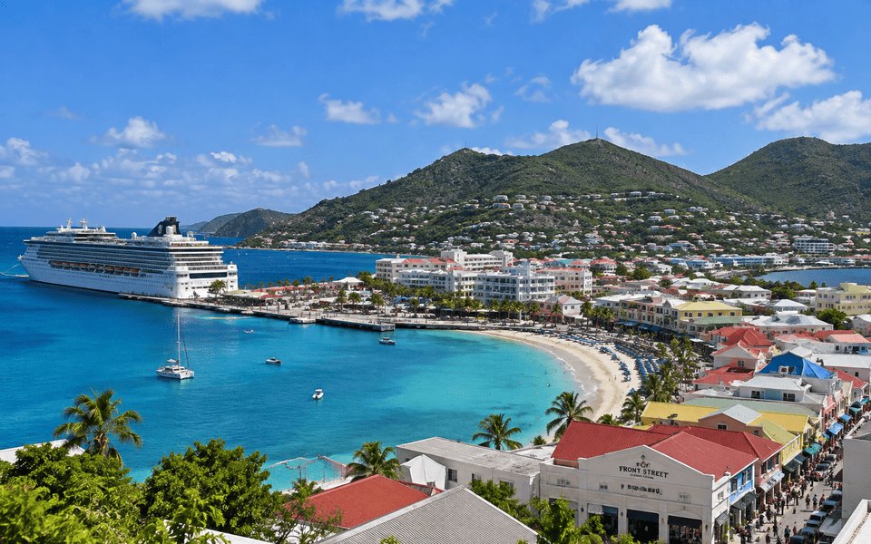 Aerial view of Great Bay in Philipsburg, Sint Maarten, with a cruise ship at the pier, turquoise water, and colourful Front Street buildings