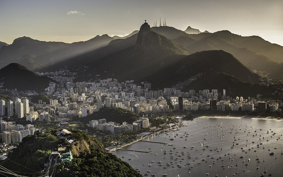 Rio de Janeiro skyline and Sugarloaf Mountain at sunset across Guanabara Bay