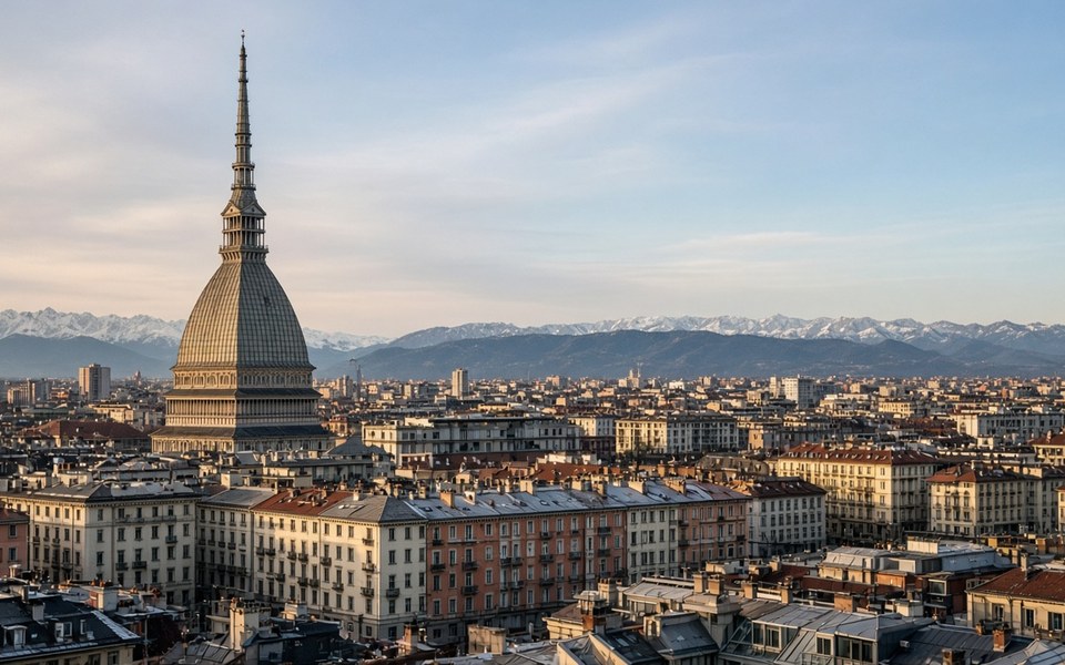 Turin rooftops with the Mole Antonelliana and snow-capped Alps on the horizon