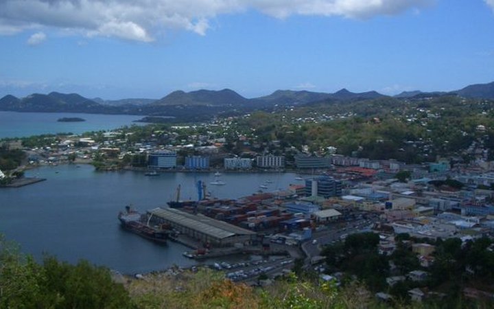 Lush green Pitons and Caribbean coastline used for the flight alert banner